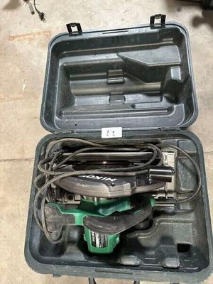 a tool case with tools in it on the floor