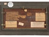 a picture of an old suitcase with a lot of papers on it