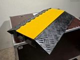 a black box with a yellow strip on top of it