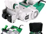a picture of a person using a power tool to cut a piece of paper