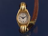 une montre-bracelet en or avec un cadran blanc sur fond bleu