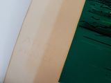 a surfboard leaning up against a wall in a room