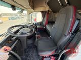 a driver ' s seat in the back of a bus