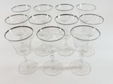 a lot of empty wine glasses sitting on a table