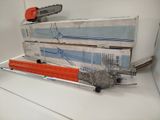 a chainsaw sitting on top of a stack of boxes