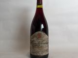 a bottle of wine that is sitting on a table