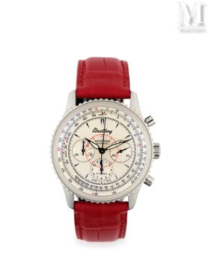 La montre est blanche et est dotée d'un bracelet rouge.