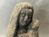 statue of a woman holding a baby in her arms