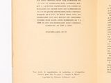 an open book on a white table with a black and white picture