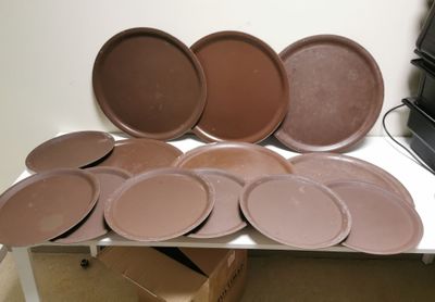 many plates and pans sitting on a white table