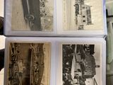 several old black and white photos of old cars in a display case