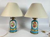 pair of blue and gold table lamps with flowers painted on them