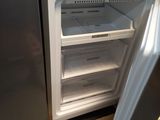 an open refrigerator with the door open in a kitchen