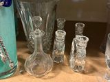 a shelf with a lot of glass items on it