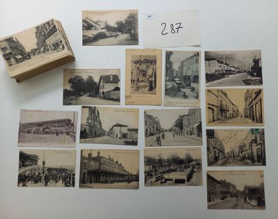 de nombreuses vieilles photos d'une ville posées sur la table