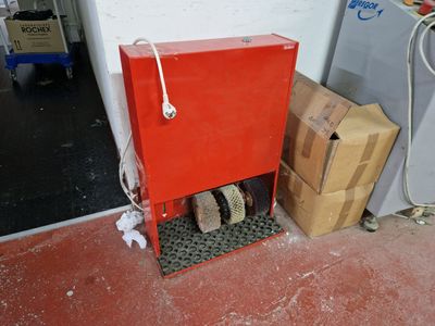 a red box that is sitting next to some boxes