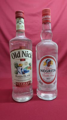 two bottles of old nick vodka sit side by side on a pink background