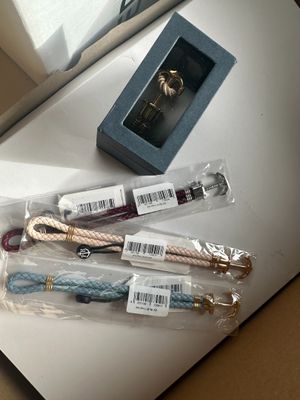 a lot of bracelets that are sitting on a table