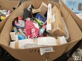 a cardboard box filled with assorted items in a store