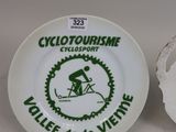 a white plate with a picture of a cyclist on it