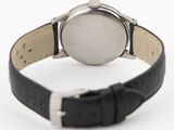 an image of a close up of a wrist watch on a white surface