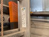an image of a metal door with a sign on it