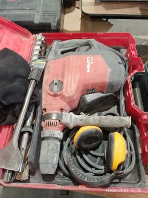 a red tool box with tools in it on a table