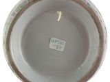 a close up of a bowl with a tag on it