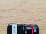 a close up of a camera on a wooden table