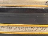 a close up of a black suitcase with a label on it
