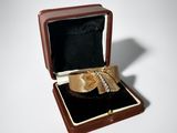 a box with a ring inside of it on a table