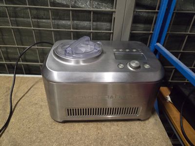 a small ice cream maker sitting on the floor