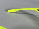 the glasses are yellow and have a black stripe on the side
