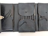 a black case that has four pairs of scissors in it