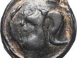 une pièce de monnaie ancienne sur laquelle figure la tête d'un homme