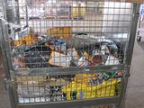 a metal cart with a bunch of food inside of it