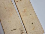 two pieces of paper that have been cut in half