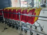 many shopping carts that are lined up in the store