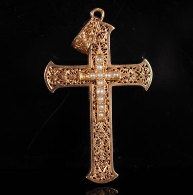 a close up of a cross on a black background