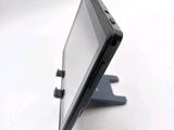 a cell phone that is sitting on top of a stand