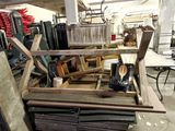 several pieces of wood are stacked on top of each other in a warehouse