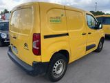 a yellow van that is parked in a parking lot