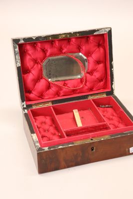a red box with a mirror and a mirror in it