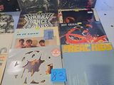 a lot of records on a table in a room