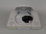 a white nintendo wii game system with a black controller
