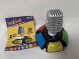 a microphone and a card on a white table