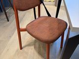 a chair that is sitting on the floor next to a table