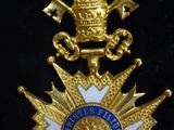 a close up of a medal on a black surface