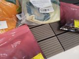many bags of food sitting on a counter in a store