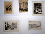 several old black and white pictures of people on a wall
